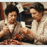 Two women examine animal organs, suggesting a haruspicy ritual.