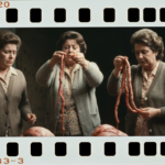 Film photo of three women examining organs. Visible labels: B-420, B3-3, and 03.